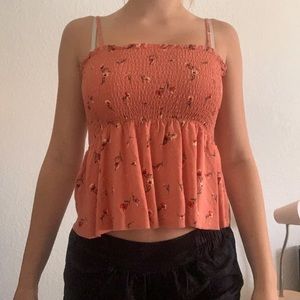 flowy coral shirt with floral designs